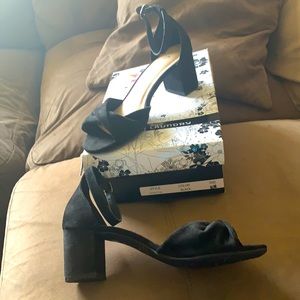 Black ankle strap low heeled sandals